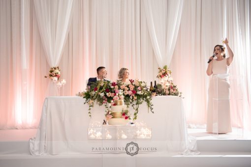 Toast to the bride and groom. Blush Theme Wedding at Millennium Gardens.